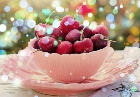 Ripe cherries in a cup