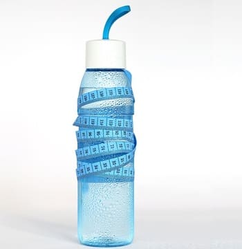 Plastic water bottle and measuring tape